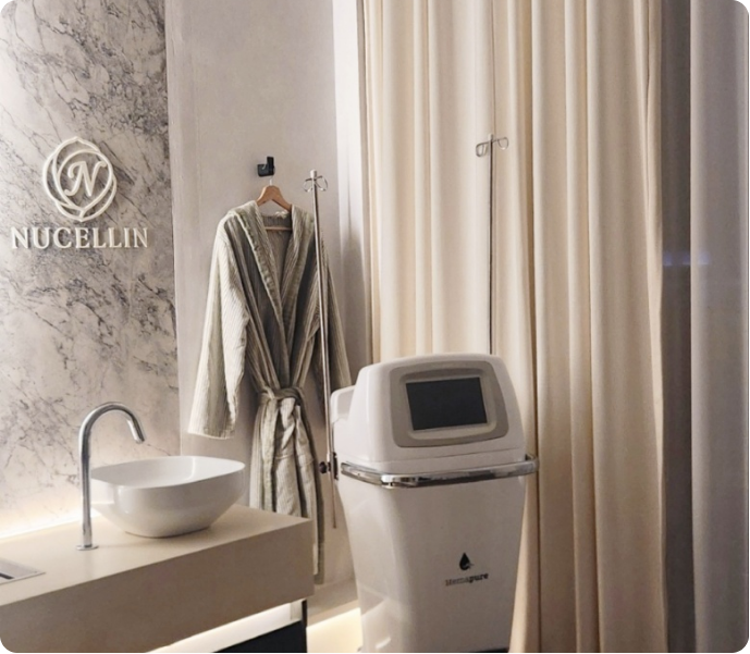 Changing area with bathrobe and body contouring device at Nucellin Orthopedic Clinic in Seoul