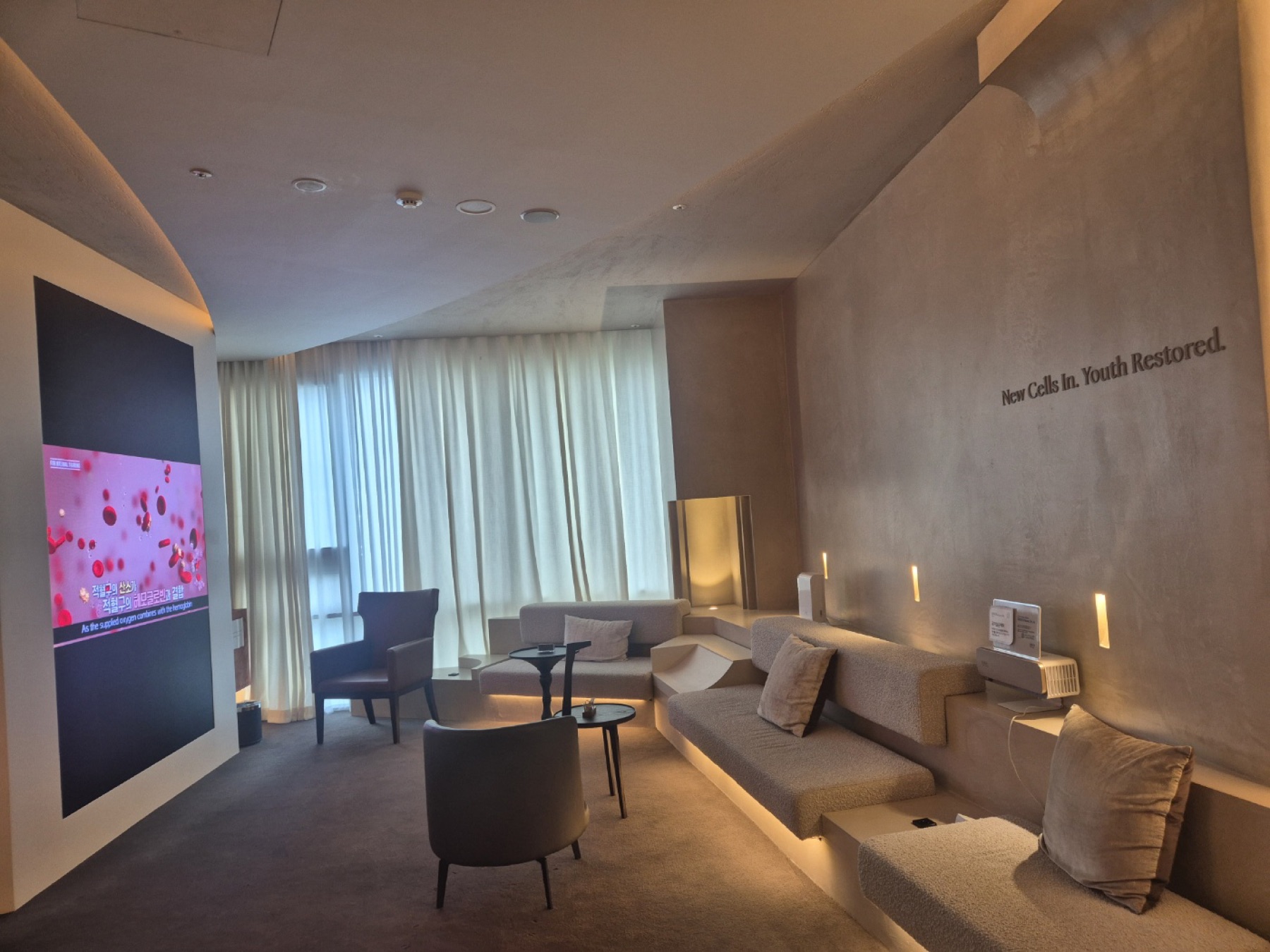 Lounge with patient education screen at Nucellin Orthopedic Clinic in Seoul